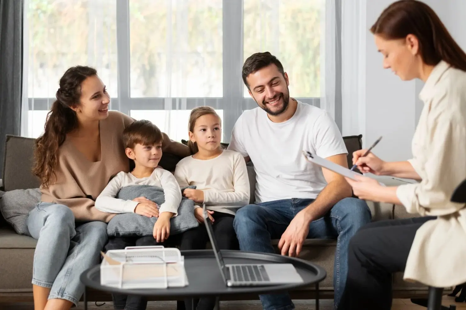 Family therapy session with a counselor explaining what is family therapy