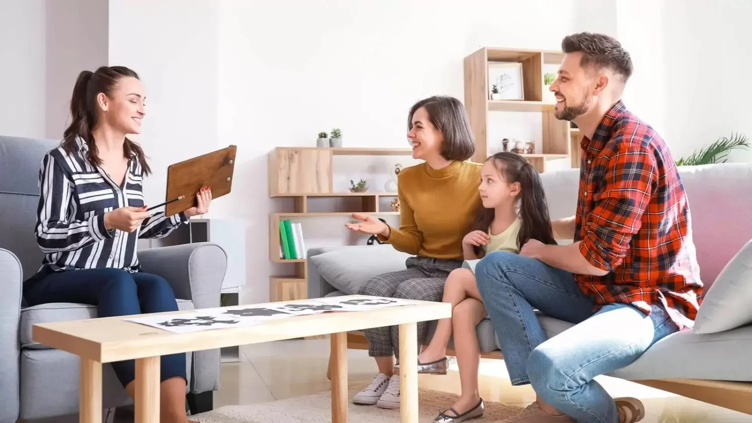 Family therapy session with counselor and family
